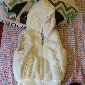 This is a furry white jacket sweater